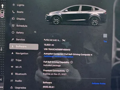 Tesla screen: FSD Included, 13,623 mi, Premium Connectivity Nov 2027